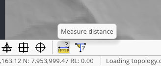 Mine design over a loaded topology in Incline, with the Measure distance tooltip identifying the ruler on the bottom toolbar.